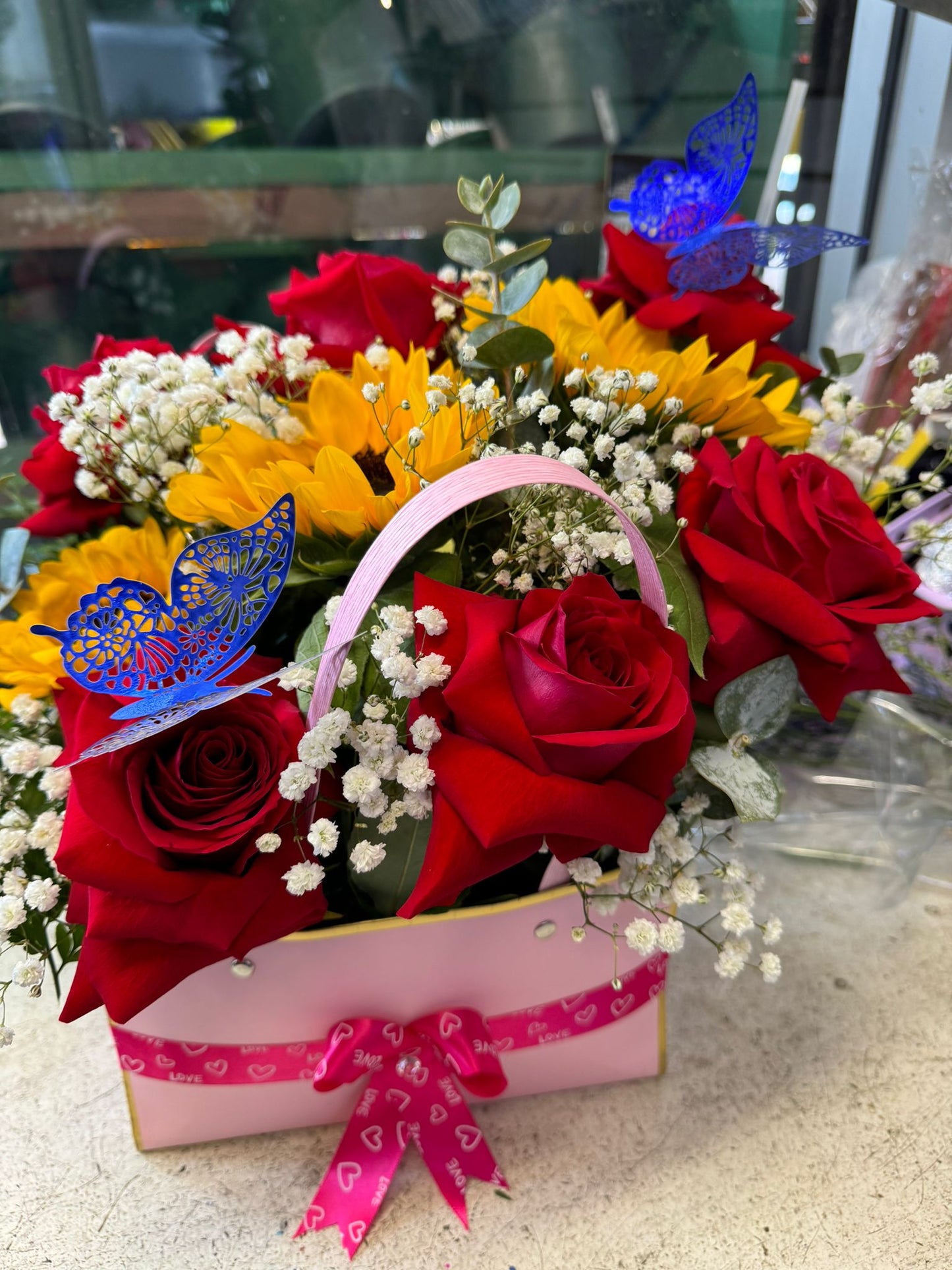 Square Floral Arrangement Of Fresh Roses And Sunflower