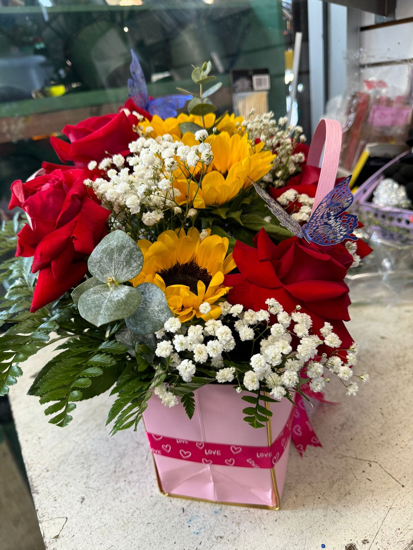 Square Floral Arrangement Of Fresh Roses And Sunflower